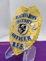 Black Falcon Security Officer gold badge with blue text. Style # 2-c13-3
