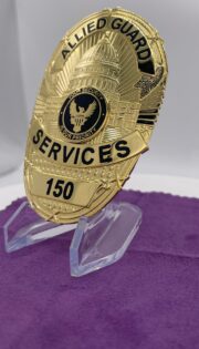 police badge a gold badge on a stand