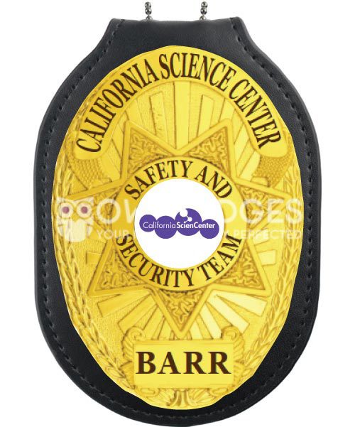 police badge holder a yellow badge with a star and text