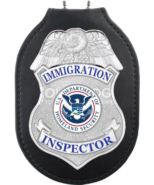 Inspector silver badge on badge holder a close-up of a badge