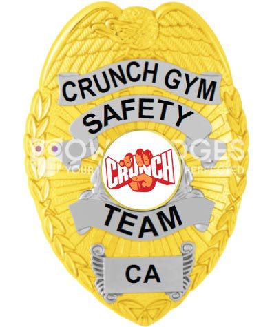 Crunch Gym safety Team Gold badge with black text and a white center seal. Style # 2-c12-4