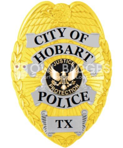 police badge city of Hobart police a yellow police badge with black text