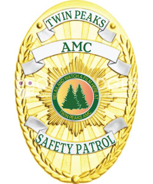 police badge a gold badge with green and white text