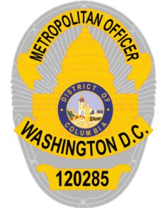 Sewable patch with gray background and black text a close-up of a badge