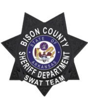 sheriff badge a black star shaped badge with white text