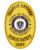 police badge Town of Balley Massachusetts a gold police badge with blue and yellow text