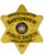 public safety badge a yellow 6 star shaped badge with black text