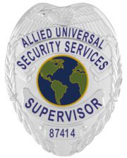 An elegant depiction of a custom metal badge in silver color, showcasing a detailed shield shape adorned with the title “Supervisor,” equipped with a safety pin attachment for easy fastening to uniforms or clothing.