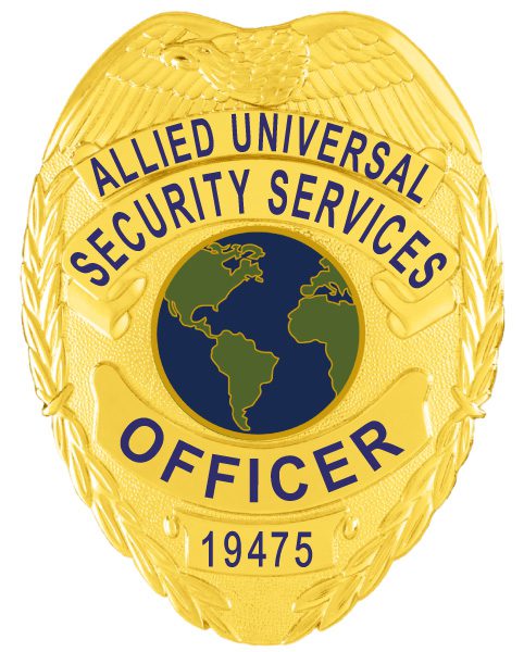 A detailed view of a custom metal badge in gold color, emphasizing its unique shield shape and intricate engravings, including the phrase “Security Services,” designed with a practical safety pin attachment for dependable use on uniforms