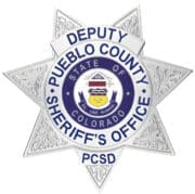 sheriff badge silver badge with blue text a close-up of a badge