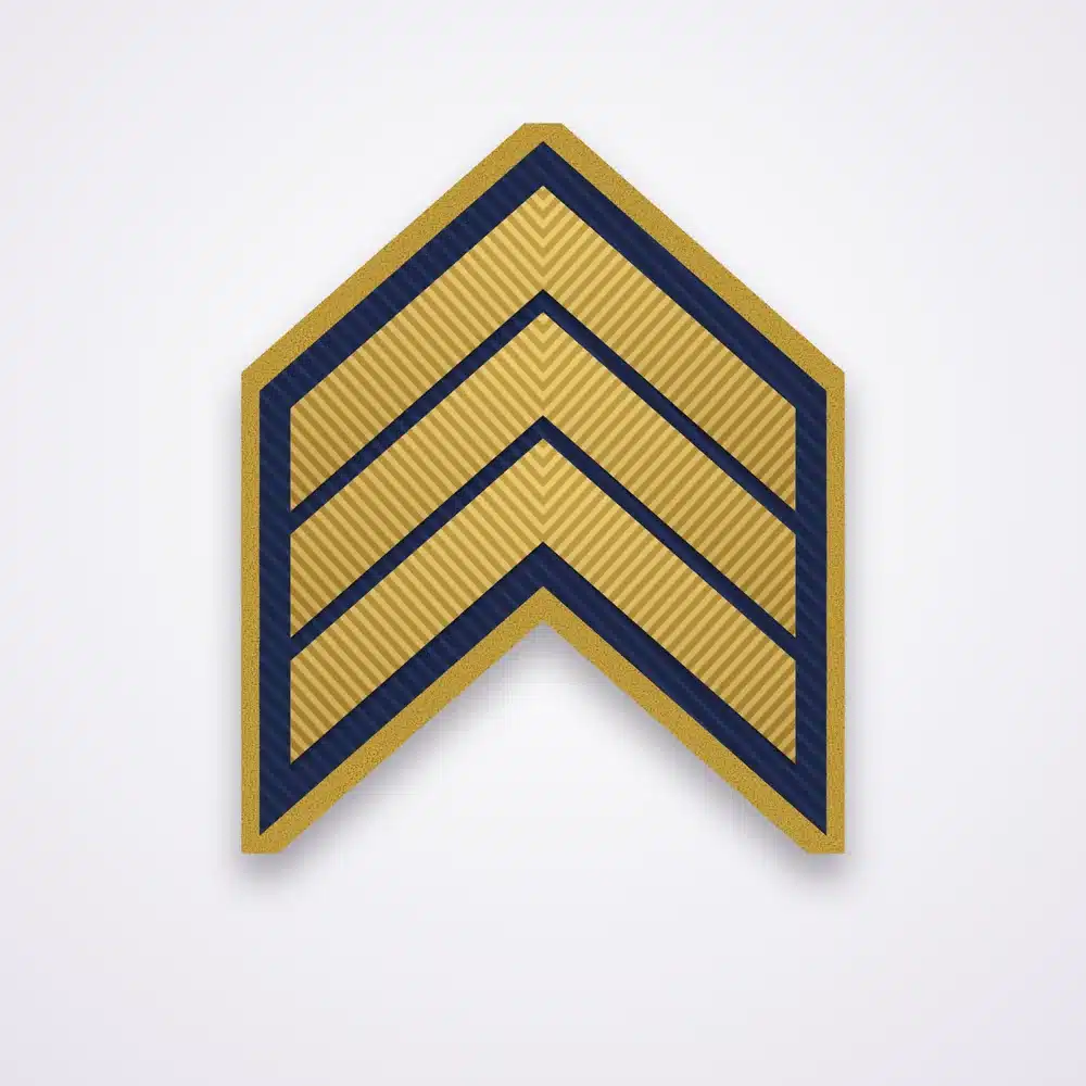 Police Ranks 1 Illustration of a three-chevron sergeant rank patch in gold thread on navy twill