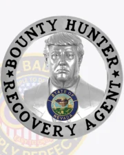 A polished custom metal badge in silver color with a bust of Donald Trump and a safety pin attachment, prominently displaying "BOUNTY HUNTER" and "RECOVERY AGENT." The badge features a detailed figure and the state seal of Nevada, symbolizing authority and professionalism in bounty hunting.