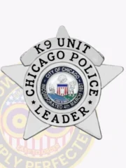Highlighting a distinctive custom metal badge in silver color, this design features a sharp star outline with "K9 UNIT" and "CHICAGO POLICE" elegantly arranged around the center, which showcases the City of Chicago's seal along with the word "LEADER." It also has a safety pin attachment for convenience.