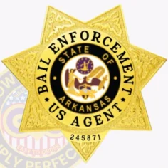 An elegant depiction of a custom metal badge in gold color, showcasing a five-pointed star shape adorned with intricate details, including the wording “bail enforcement” and “state of arkansas,” equipped with a safety pin attachment for easy fastening to clothing.