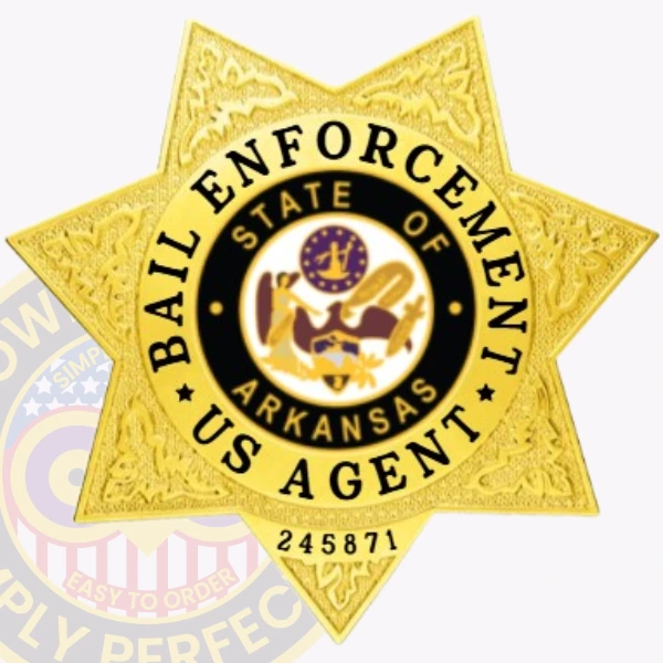An elegant depiction of a custom metal badge in gold color, showcasing a five-pointed star shape adorned with intricate details, including the wording “Bail Enforcement” and “State of Arkansas,” equipped with a safety pin attachment for easy fastening to clothing.