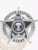 A detailed view of a custom metal badge in silver color, exhibiting an elegant star design with prominent text stating “Fugitive Recovery,” designed with a practical safety pin attachment for dependable use on uniforms.