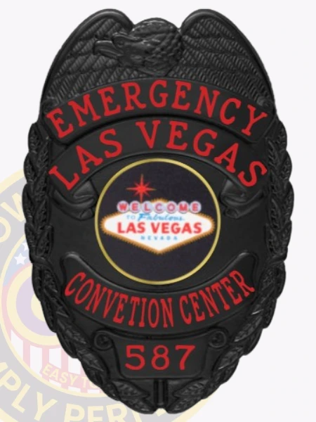 This distinctive custom metal badge in black color stands out with its bold "EMERGENCY LAS VEGAS" inscription and an emblem representing the city. The badge is marked with the number 587 and features a safety pin attachment, ensuring it can be securely worn during events at the convention center.