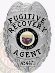 A polished image of a custom metal badge in silver color, featuring an eagle-adorned design with the inscription “Fugitive Recovery” and “Agent,” along with a central emblem representing the State of Arizona, complete with a safety pin attachment for secure wear.