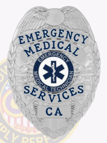 Featuring a detailed custom metal badge in silver color with a secure safety pin attachment, this badge reads "EMERGENCY MEDICAL SERVICES" at the top. The star of life emblem at the center emphasizes its importance in emergency care, reinforcing the commitment of medical technicians to public safety.