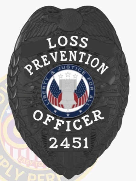 Featuring a custom metal badge in black color, this design highlights the title "LOSS PREVENTION OFFICER" and includes a decorative emblem at the center. The badge displays the identifier 2451 and is equipped with a safety pin attachment for convenient wear, making it ideal for official use.