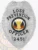 An eye-catching custom metal badge in silver color, adorned with "LOSS PREVENTION OFFICER" prominently displayed above a central emblem symbolizing liberty and justice. The badge features a unique identification number, 2451, and comes with a safety pin attachment for secure placement.