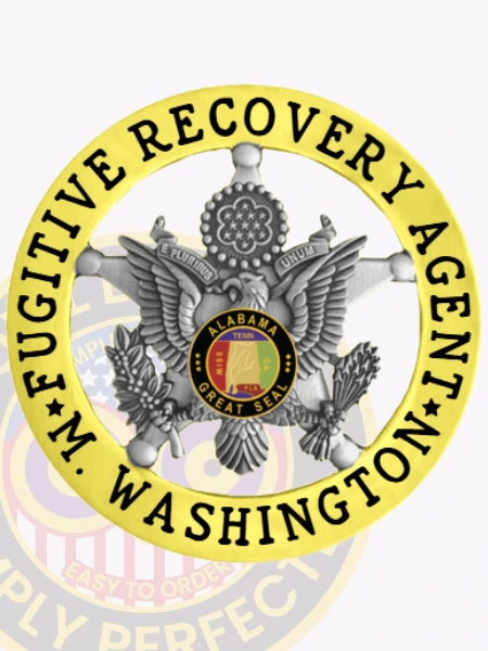 A polished custom metal badge in gold color with a safety pin attachment, prominently displaying "FUGITIVE RECOVERY AGENT" and "WASHINGTON." The badge features a detailed eagle emblem and the Alabama state seal, symbolizing authority and professionalism in fugitive recovery.