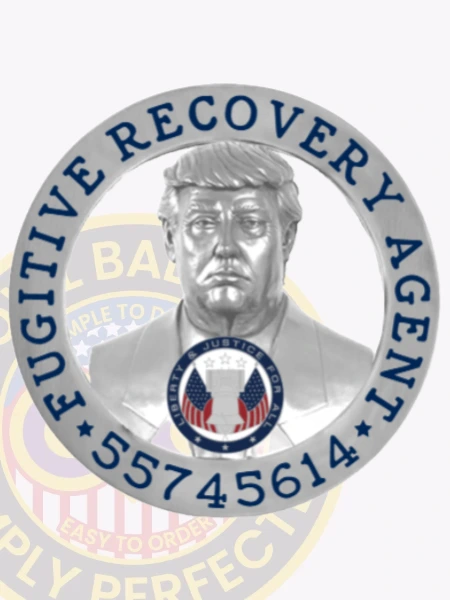 A detailed image of a custom metal badge in silver color with a safety pin attachment, highlighting "55745614" alongside the central figure and decorative elements. This badge’s refined design showcases its importance as a distinguished accessory for recovery agents.