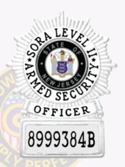 "SORA Level 2 officer badge in a custom silver starburst design, displaying the official State of New Jersey seal in the middle, bold black text around the seal, and a rectangular ID panel with the number '8999384B,' equipped with a safety pin fastener.