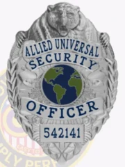 An impressive custom metal badge in silver color, adorned with a bear figure and the title "ALLIED UNIVERSAL SECURITY OFFICER." The globe graphic at the center emphasizes its significance in global security efforts, while the safety pin attachment ensures secure placement. The badge also displays the unique number 542141.