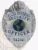 An impressive custom metal badge in silver color, adorned with a bear figure and the title "ALLIED UNIVERSAL SECURITY OFFICER." The globe graphic at the center emphasizes its significance in global security efforts, while the safety pin attachment ensures secure placement. The badge also displays the unique number 542141.