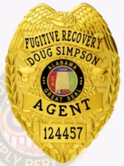An engaging representation of a custom metal badge in gold color, emphasizing its unique shield shape and intricate details, including the wording “Fugitive Recovery Agent” and a safety pin attachment for effortless integration into attire.