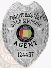 An engaging representation of a custom metal badge in silver color, exhibiting an elegant design with the name “Doug Simpson” and the title “Fugitive Recovery Agent,” designed with a practical safety pin attachment for dependable use on clothing.