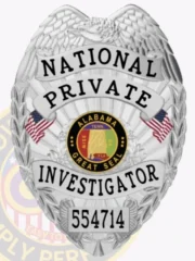 Close-up view of a custom metal badge in silver color with a safety pin attachment, highlighting the inscription "NATIONAL PRIVATE INVESTIGATOR." The badge's intricate detailing includes the Alabama state seal, adding an element of sophistication to this essential accessory.
