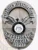 Close-up view of a custom metal badge in silver color with a safety pin attachment, highlighting "INVESTIGATOR GEORGIA 93737." The intricate details include an eagle motif and the state seal, emphasizing authority and expertise in investigative work.
