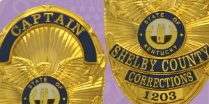 A detailed graphic demonstrating 'How to order Reverse Enamel Badges.' The image features two distinct badges: the left badge is labeled 'CAPTAIN' with an intricate design and a golden finish, while the right badge displays 'SHELBY COUNTY CORRECTIONS' with a central emblem representing the state of Kentucky. Both badges showcase their unique reverse enamel craftsmanship against a purple background, highlighting their quality and appeal for custom badge orders.