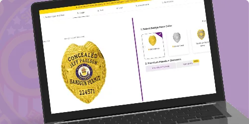 A laptop screen displaying an online customization tool for creating custom concealed carry weapons badges and CCW badges. The featured badge is a gold oval design with the text 'CONCEALED' prominently displayed at the top, followed by the name 'JEFF PAULSON' and 'HANDGUN PERMIT' below. The badge number '224571' is clearly visible, adding a personal touch. On the right side of the interface, users can choose badge colors, including options like silver and black, as well as premium finishes for further customization. This image effectively illustrates where to buy custom concealed carry weapons badges and gun permit badges through a user-friendly online platform.