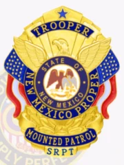 A custom metal badge in gold with reverse enamel panels, featuring intricate designs including an eagle and blue accents. The badge displays 'TROOPER' at the top, 'NEW MEXICO PROPER' in the center, and 'MOUNTED PATROL SRPT' at the base, showcasing its personalized and authoritative design.