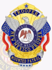 A custom metal badge in gold with silver and reverse enamel panels, showcasing intricate details like an eagle and vibrant blue accents. The badge features the text 'TROOPER' at the top, 'NEW MEXICO PROPER' in the center, and 'MOUNTED PATROL' at the base, highlighting its authoritative and personalized design.