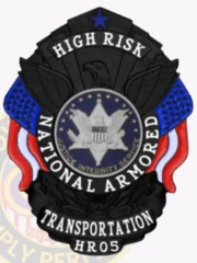 This striking custom metal badge in black color includes a safety pin attachment and showcases the word "HIGH RISK" prominently at the top. The central eagle motif is surrounded by "NATIONAL ARMORED TRANSPORTATION," framed by bold red and blue elements, emphasizing its significance in high-security contexts.