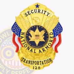 A detailed close up image of a custom metal badge in gold color with safety pin attachment, featuring the "security national armored transportation" title. The badge is embellished with an eagle motif and stars, emphasizing its significance and polished finish.