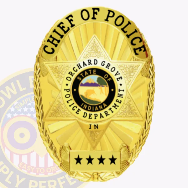 Orchard Grove police chief of police custom gold oval metal badge with a bright gold background and six-point star design surrounding the colorful Indiana state seal, bold black lettering CHIEF OF POLICE along the top edge, ORCHARD GROVE POLICE DEPARTMENT encircling the seal, and four black stars on a gold plate near the base, designed with safety pin attachment.