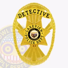 This stylish custom metal badge in gold presents a traditional star shape, enhanced by detailed etching and a brilliant finish. The top section reads "detective" in prominent black font. Centrally located is the lakeview police department seal, framed by "state of arizona" and "lakeview police dept. " in black, enhancing its authority. A durable safety pin attachment allows for easy wear.