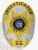 This striking custom metal badge in silver color is adorned with gold panels, displaying a star shape. The badge reads "INVESTIGATOR" and includes the State of New York emblem, numbered "22" at the bottom, secured by a safety pin for convenient attachment.