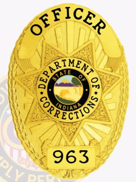 Custom metal badge in gold with safety pin attachment, designed for an officer in the Indiana Department of Corrections. The badge features a star shape with "OFFICER" displayed prominently at the top, and "DEPARTMENT OF CORRECTIONS" encircling a central state emblem. The badge is adorned with a unique design and a badge number "963" at the bottom, enhancing its official appearance. The safety pin attachment ensures secure fastening to uniforms, providing both functionality and a polished look for law enforcement professionals.