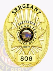 Gold oval custom metal badge for Clearwater Police Sergeant displaying a large star with the Alaska state seal at the center, surrounded by text including "CARTERTON," "CLEARWATER POLICE DEPT.," and "COUNTY," with "SERGEANT" on an arched banner above and badge number "808" at the base, fastened with a safety pin.