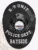 Black oval custom metal badge for Bayside Police K-9 Unit, featuring an eagle's head silhouette above the circular New Hampshire state seal, surrounded by white text stating "K-9 UNIT" on top, "POLICE DEPT." in the center, and "BAYSIDE" at the base, fastened with a safety pin.