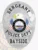 Detailed silver oval police badge for Bayside Sergeant featuring an eagle with a yellow beak above the New Hampshire state seal in the center, flanked by American flags, highlighted by black lettering "SERGEANT," "POLICE DEPT.," and "BAYSIDE," designed with a safety pin attachment.