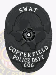 Black oval metal badge featuring the Texas shape in the middle, a star emblem marked "STATE OF TEXAS," and bold white lettering displaying "SWAT" above and "COPPERFIELD POLICE DEPT. 606" underneath, made for Copperfield police SWAT with safety pin backing.