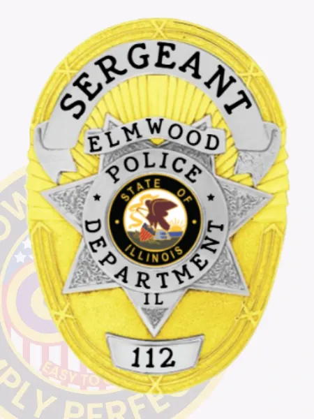 Custom gold oval metal badge for Elmwood police sergeant with safety pin attachment, displaying a large silver 7-point star centerpiece framed by black text on white banners spelling out "SERGEANT," "ELMWOOD," and "POLICE DEPARTMENT IL," plus badge number "112."