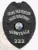 Black metal police badge for Sunnydale Crime Prevention featuring a finely detailed eagle on the upper part, bold white text CRIME PREVENTION and POLICE DEPARTMENT on curved banners, the State of Florida seal in vibrant colors centered, SUNNYDALE printed bold below it, and badge number 222 on a black plate at the bottom, attached using a safety pin.